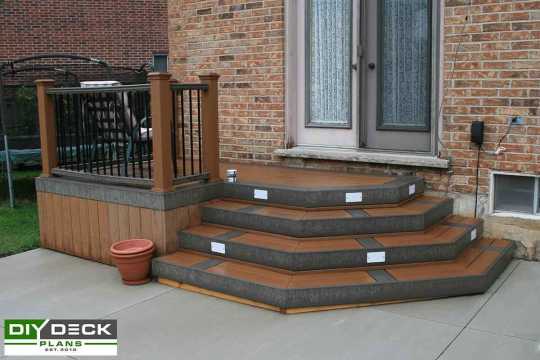 Small single level deck attached to a house.