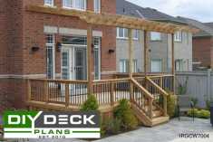Medium size deck with a pergola attached to a red brick house.
