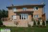 Large 2-level deck with a planter and a privacy screen.