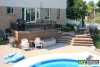 Large 2-level deck with planter boxes beside the steps.