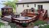 Large 2-level deck with planters and a wrap-around bench.